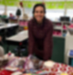 A Saint Nicholas Catholic School mom smiles as she volunteers in a classroom at school.