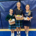 This image links to the Saint Nicholas Catholic School hot lunch page. The image depicts three students happily showing off their hot lunches.