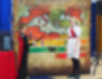 A link to the Saint Nicholas Catholic School Academics page. The photograph shows 6th grade students participating in a Walk Through Ancient History, an interactive learning experience.
