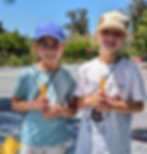 A link to the Saint Nicholas Catholic School Social Emotional Learning page. The photo shows two elementary school students during the Saint Nicholas School walkathon.