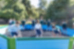 This image links to the Saint Nicholas Catholic School Student Life page.  This photograph shows a group of students playing gaga ball at recess