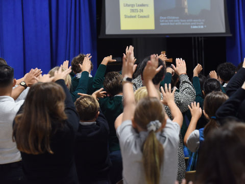 Students praying together at Saint Nicholas Catholic School in Los Altos, California