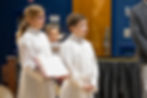 Two altar servers at a Saint Nicholas Catholic School Mass in Los Altos California