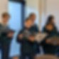 This image links to the Saint Nicholas Catholic School after school activities page. It shows middle-school members of the choir singing for seniors at Lunch Bunch, a gathering for seniors at the St. Nicholas and Saint William parish.