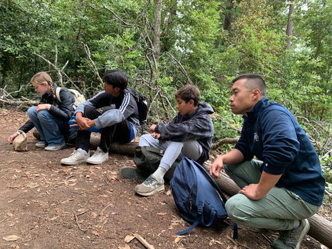 Middle School Students from Saint Nicholas Catholic School sitting and contemplating nature on a retreat in Sonoma.