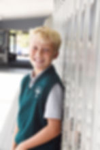 A link to the Saint Nicholas Catholic School Junior High School Academics page. The photo depicts a student in middle school at his locker.