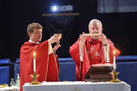 Our parish priest and pastor saying mass at Saint Nicholas Catholic School