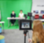 A link to the Junior High School Academics Page. The image shows Middle School students using a green screen to make a video in the technology lab at Saint Nicholas Catholic School